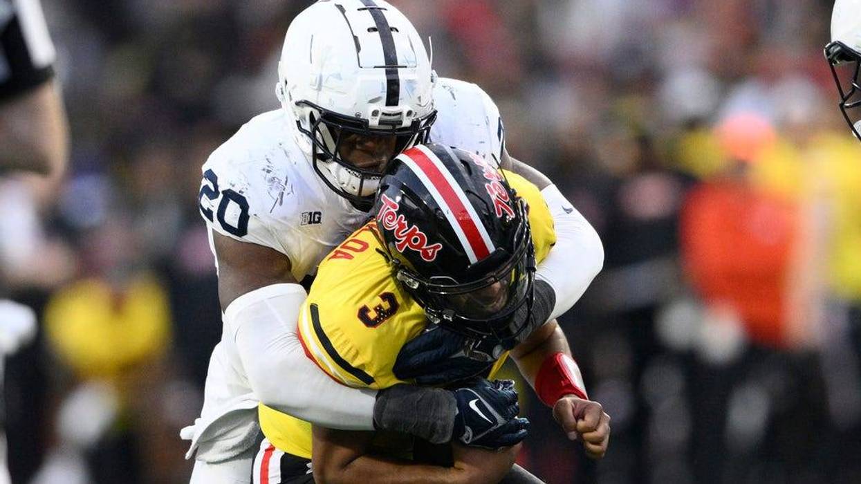 Penn State defensive end Adisa Isaac (20) sacks Maryland quarterback Taulia Tagovailoa (3) during the second half of an NCAA college football game, Saturday, Nov. 4, 2023, in College Park, Md. (AP Photo/Nick Wass)