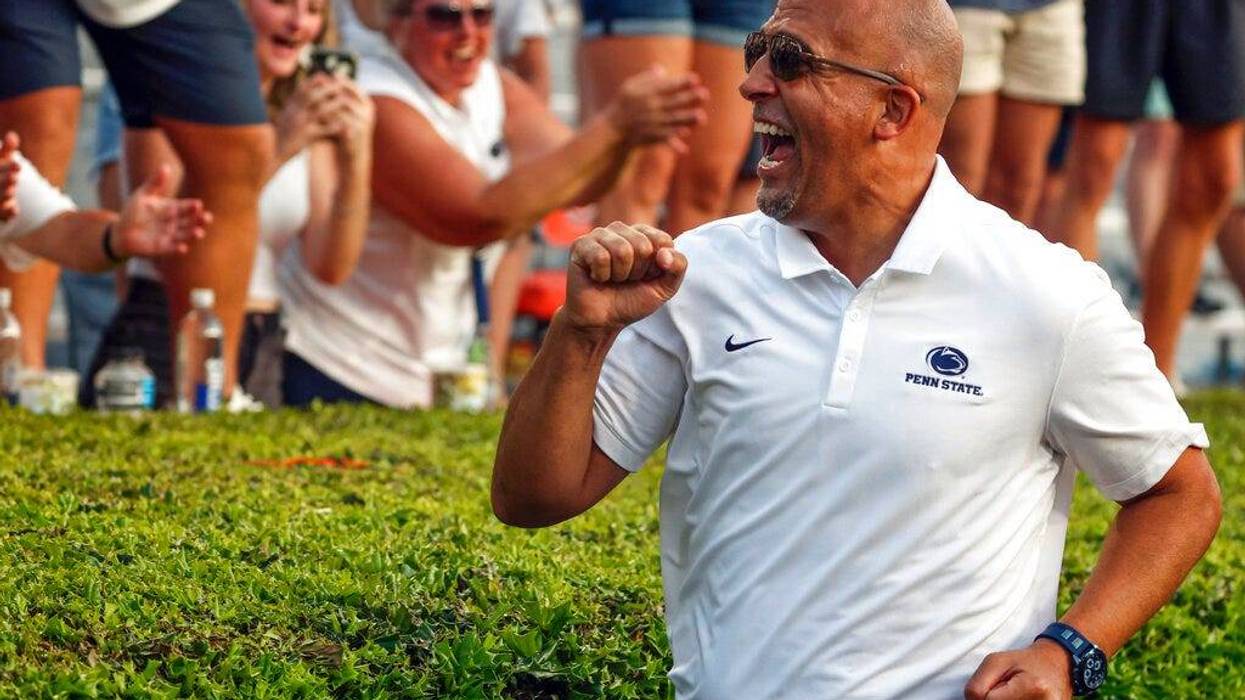Penn State head coach James Franklin celebrates with fans after their victory over Auburn in an NCAA college football game, Saturday, Sept. 17, 2022, in Auburn, Ala. (AP Photo/Butch Dill)