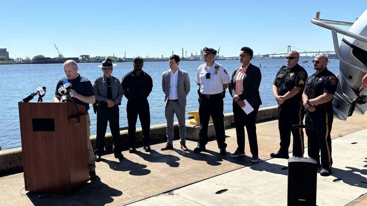 PennDOT's Din Abazi, with other officials, addresses reporters at Philadelphia's Coast Guard station on Wednesday, June 24.