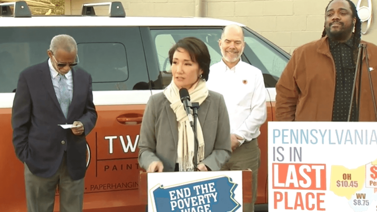 Pennsylvania state Senator-elect Patty Kim (center) addresses reporters at Two Dudes Painting Company in Lancaster, Pa. on Tuesday, Dec. 31, 2024, flanked by (l to r.) state Sen. Art Haywood, Two Dudes owner Pete Barber and state Rep. Ismail Smith-Wade-El.