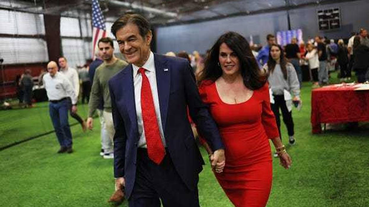 Pennsylvania U.S. Senate candidate Dr. Mehmet Oz and his wife Lisa Oz leave a Republican leadership forum at Newtown Athletic Club on May 11, 2022 in Newtown, Pennsylvania.