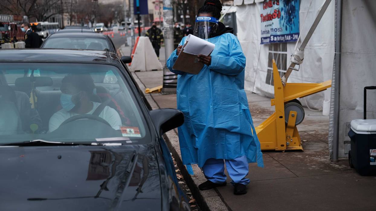 People are tested in a mobile clinic in downtown Newark as the city experiences a rise in Covid-19 cases on November 25, 2020 in Newark, New Jersey.