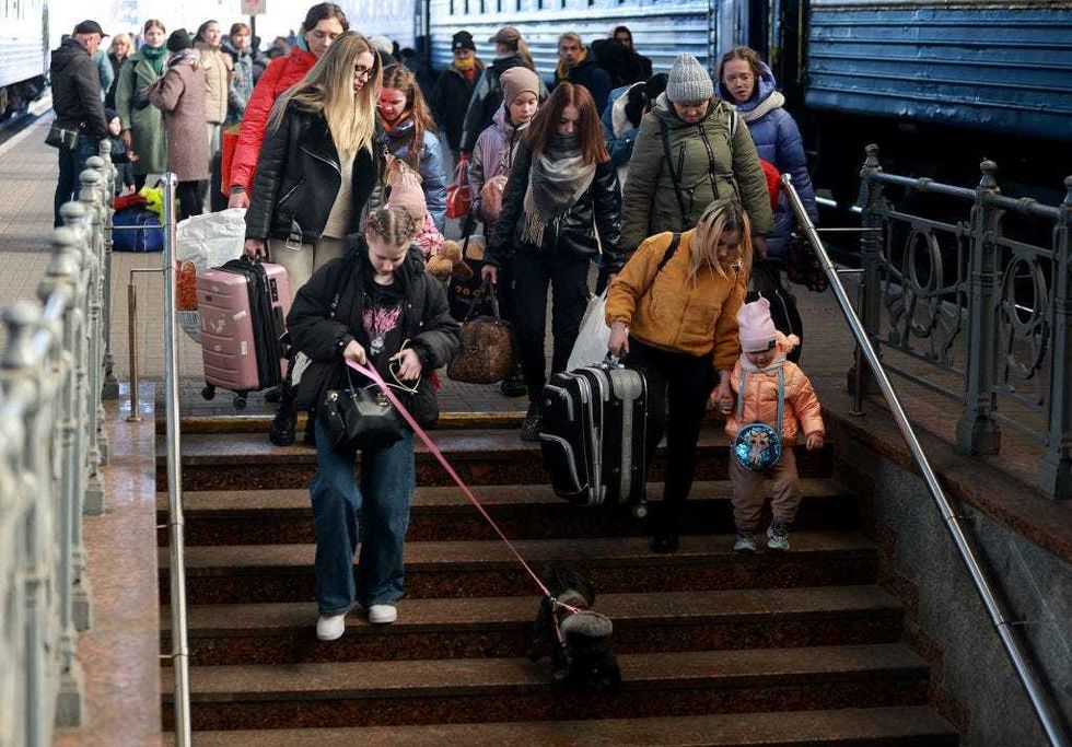 People arrive at the main train station from Zaporizhzhia on March 24, 2022 in Lviv, Ukraine. More than 3 million people have fled Ukraine, with millions more internally displaced, after Russia