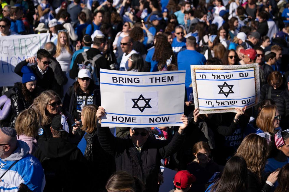 People arrive for the March for Israel on the National Mall November 14, 2023 in Washington, DC.