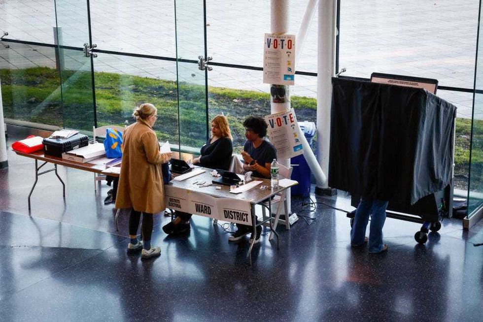 People arrive to cast their vote at the Babbio Center on Nov. 5, 2024 in Hoboken, New Jersey.