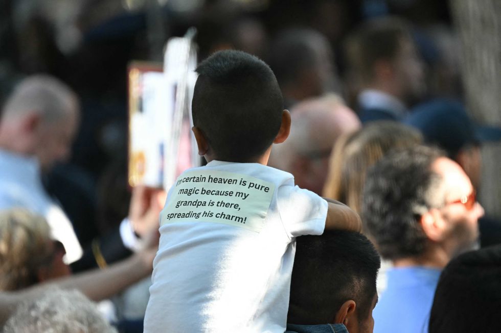 People attend a remembrance ceremony on the 23rd anniversary of the September 11 terror attacks