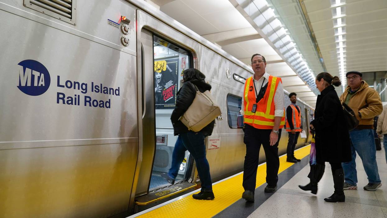 People board a Long Island Railroad train in the new annex to Grand Central Station in New York, Wednesday, Jan. 25, 2023.