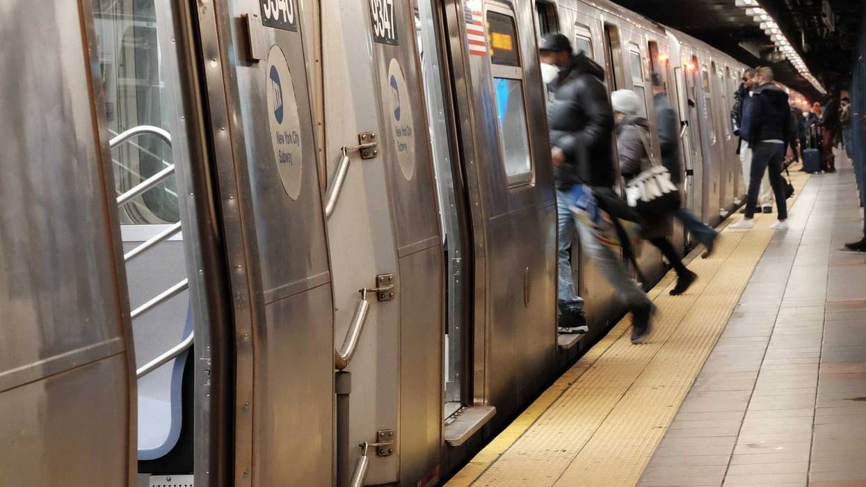 People board a subway on in New York City.