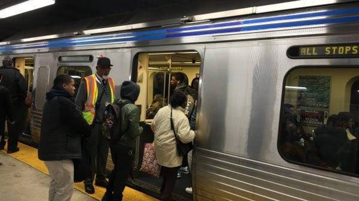 People boarding the Market Frankford Line.