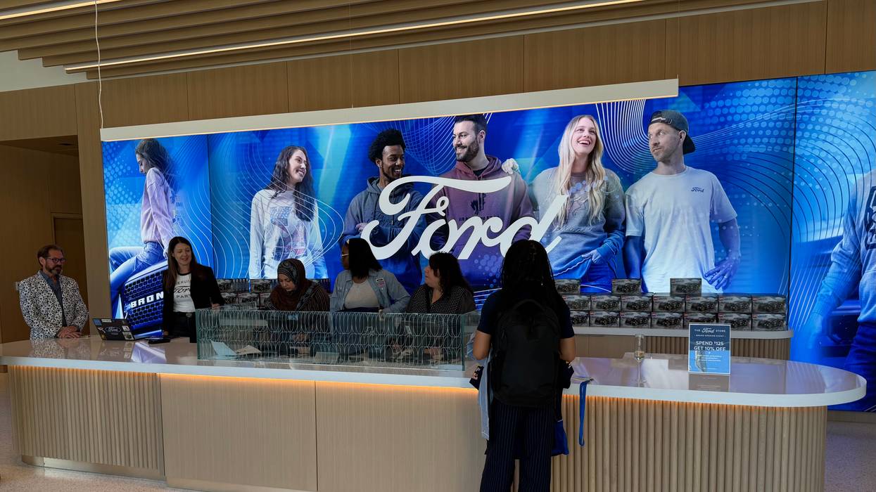 People buy merchandise at Ford gift shop