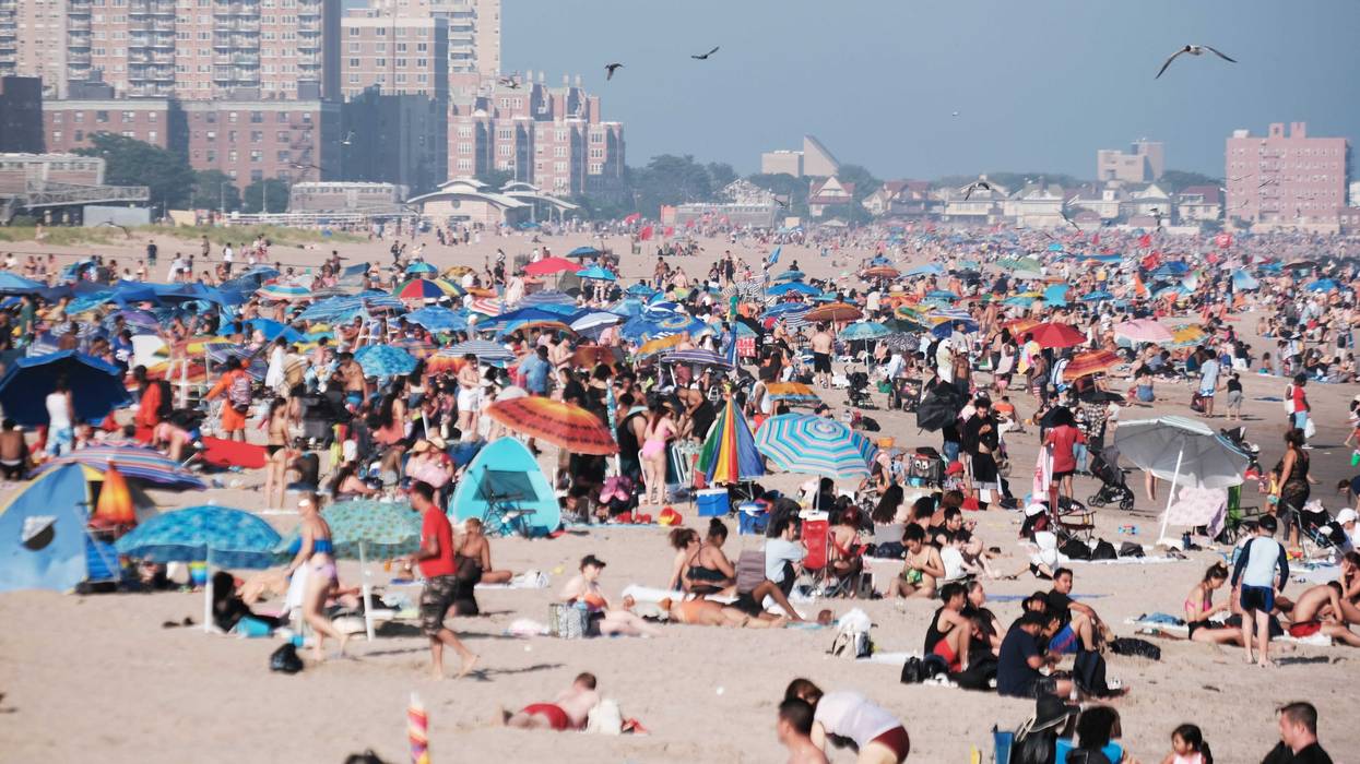 People cool off at the beach in Coney Island on July 6, 2023