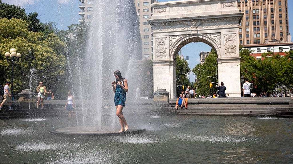 People cool off in a fountain in Washington Square Park as the region experiences another heatwave on July 29, 2025 in New York City. Temperatures are expected to reach into the high 90s with a heat index well above 100 degrees.