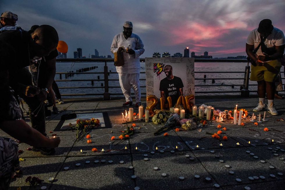 People create a makeshift memorial for O