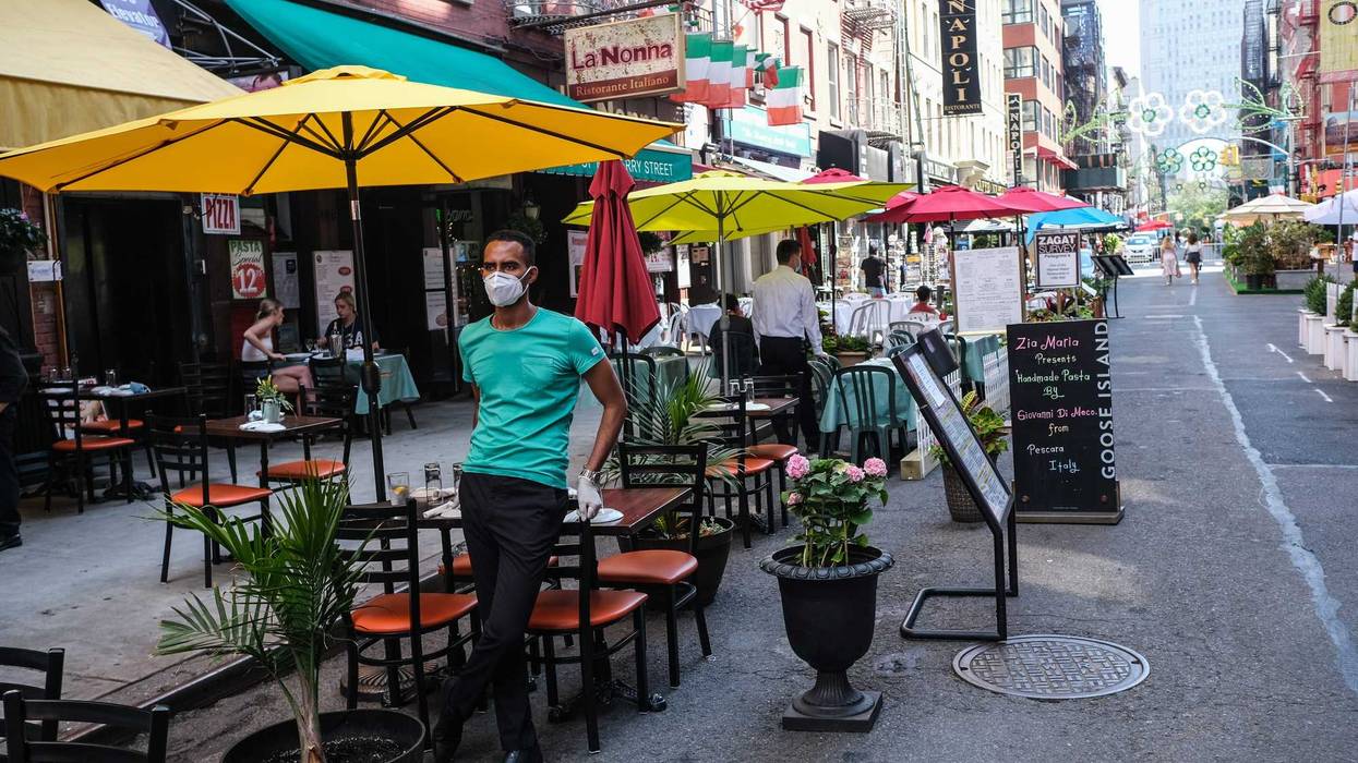 People dine al fresco in Little Italy on Mulberry Street between Hester and Broome Streets on July 4, 2020 in the Manhattan borough of New York City.