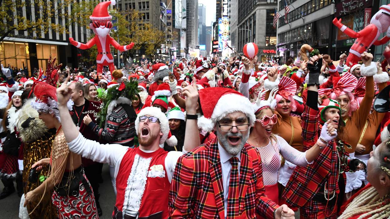 People dressed in Santa Claus costumes participate in SantaCon in Manhattan