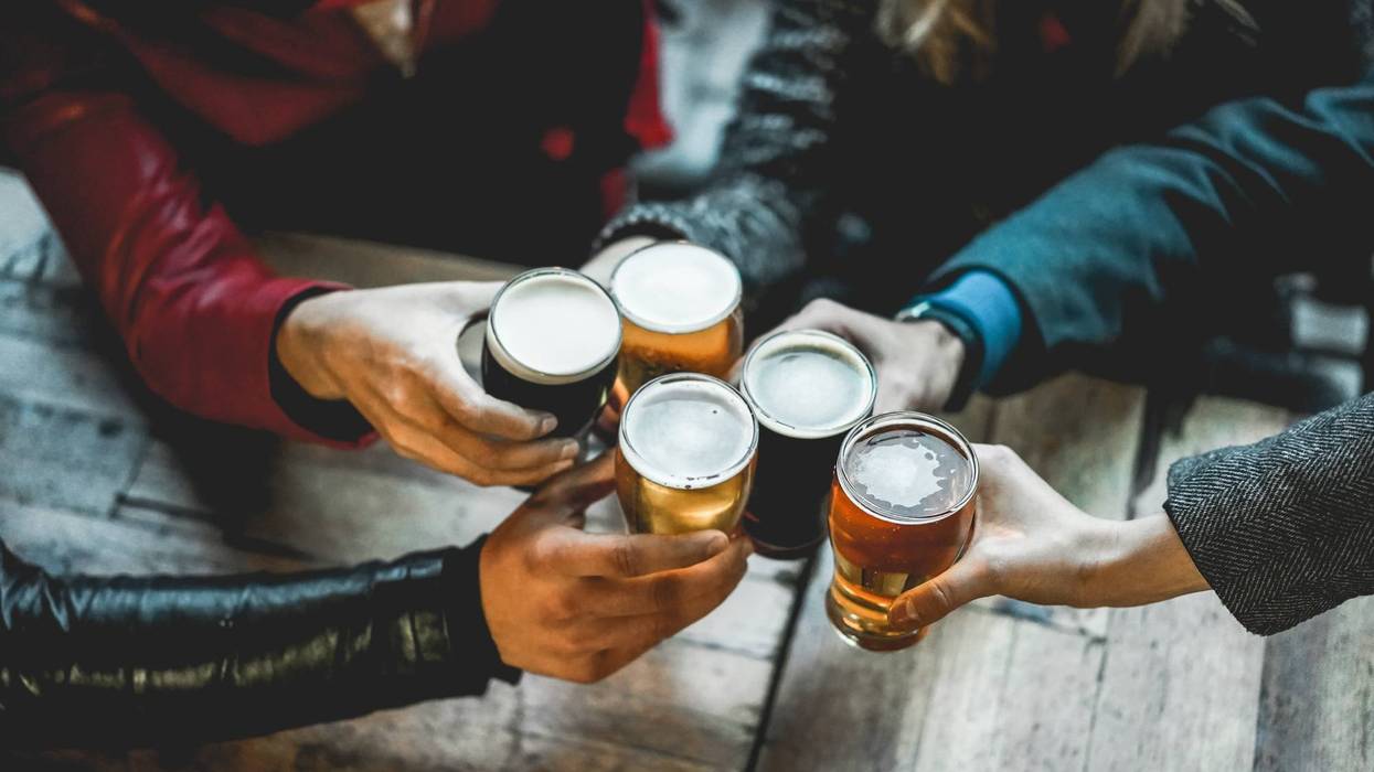 People drinking beer at a bar.