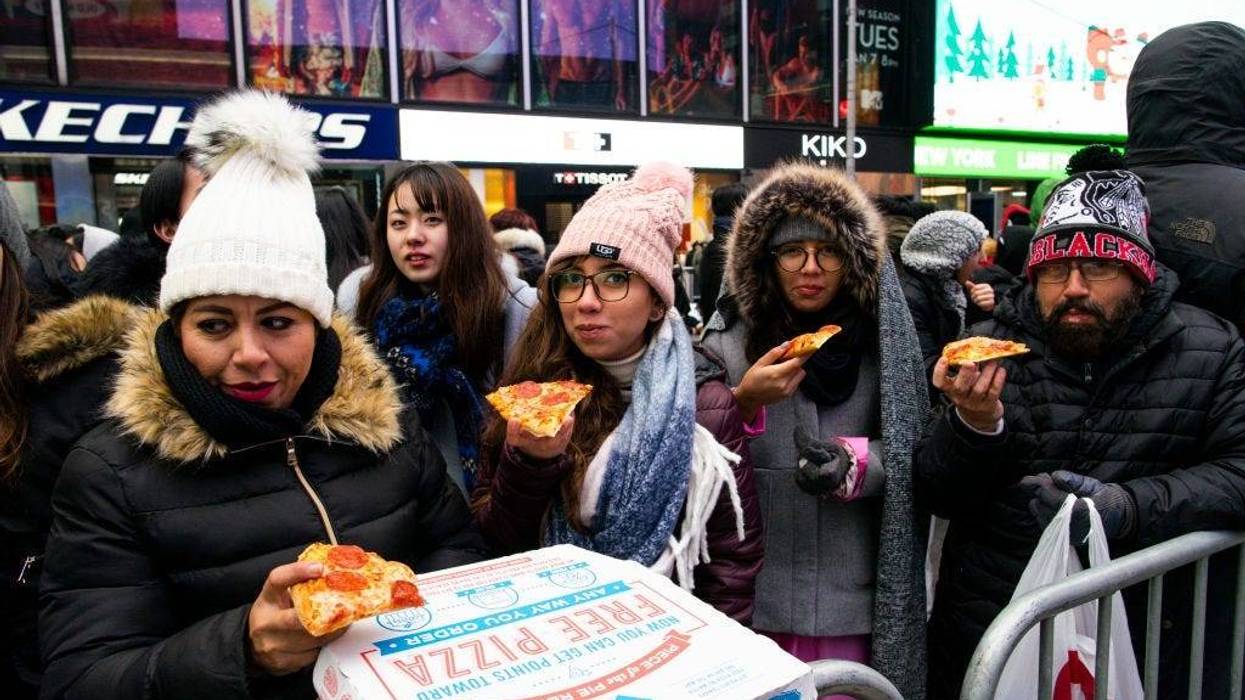 People eating Pizza in Times Square