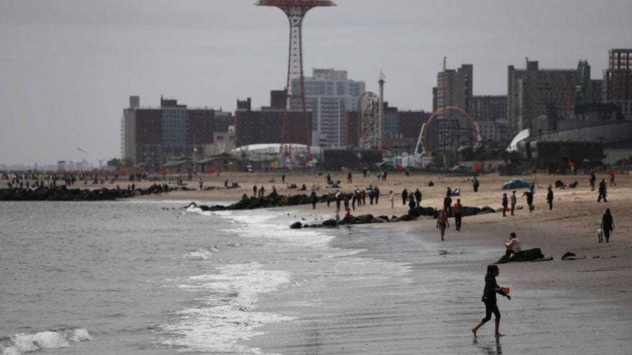 People enjoy an afternoon at Brooklyn's Brighton Beach on Memorial Day weekend, the traditional start of the summer season in the United States on May 24, 2020.