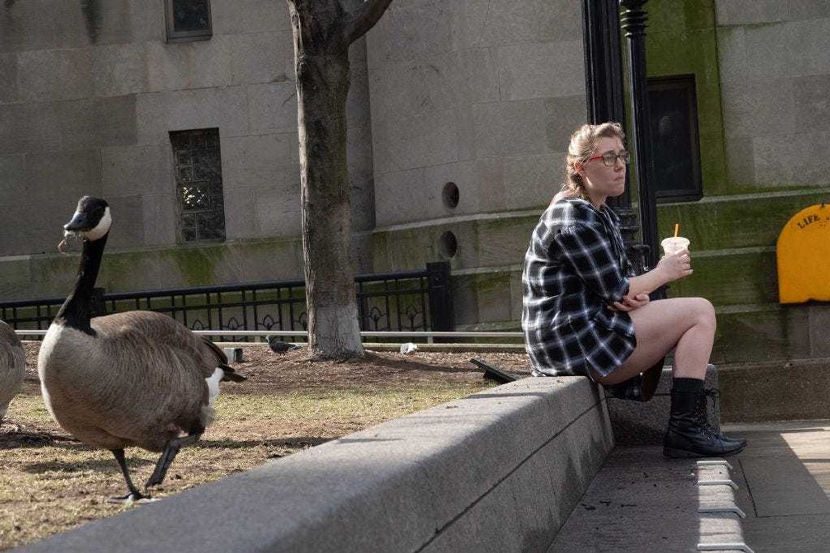 People enjoy lunch along the downtown Riverwalk during an unusually warm winter day on February 27, 2024 in Chicago, Illinois. The 70-degree temperatures are expected to be replaced by wind, rain, hail and the possibility of snow as a cold front pushes into the city later in the evening. (Photo by Scott Olson/Getty Images)