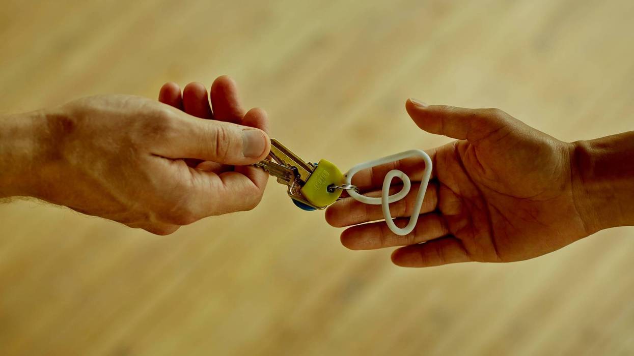 people exchanging a set of keys