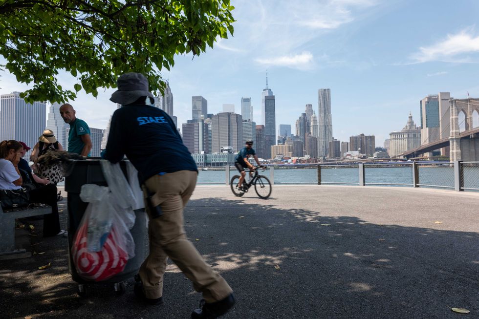 People gather along the Brooklyn waterfront on July 9, 2024