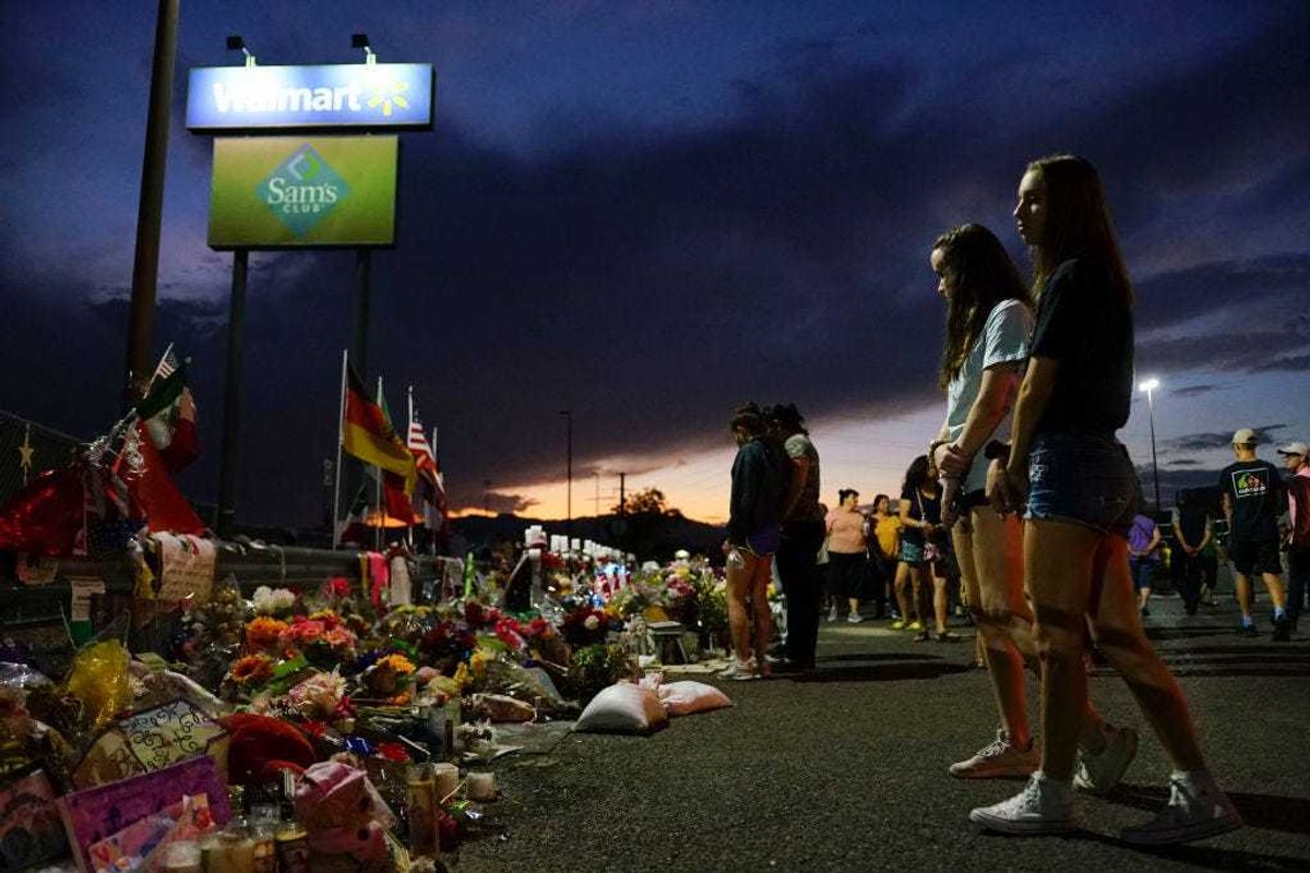 People gather at a makeshift memorial honoring victims outside Walmart August 15, 2019 in El Paso, Texas. 22 people were killed in the Walmart during a mass shooting on August 3rd. A 21-year-old white male suspect remains in custody in El Paso which sits along the U.S.-Mexico border.