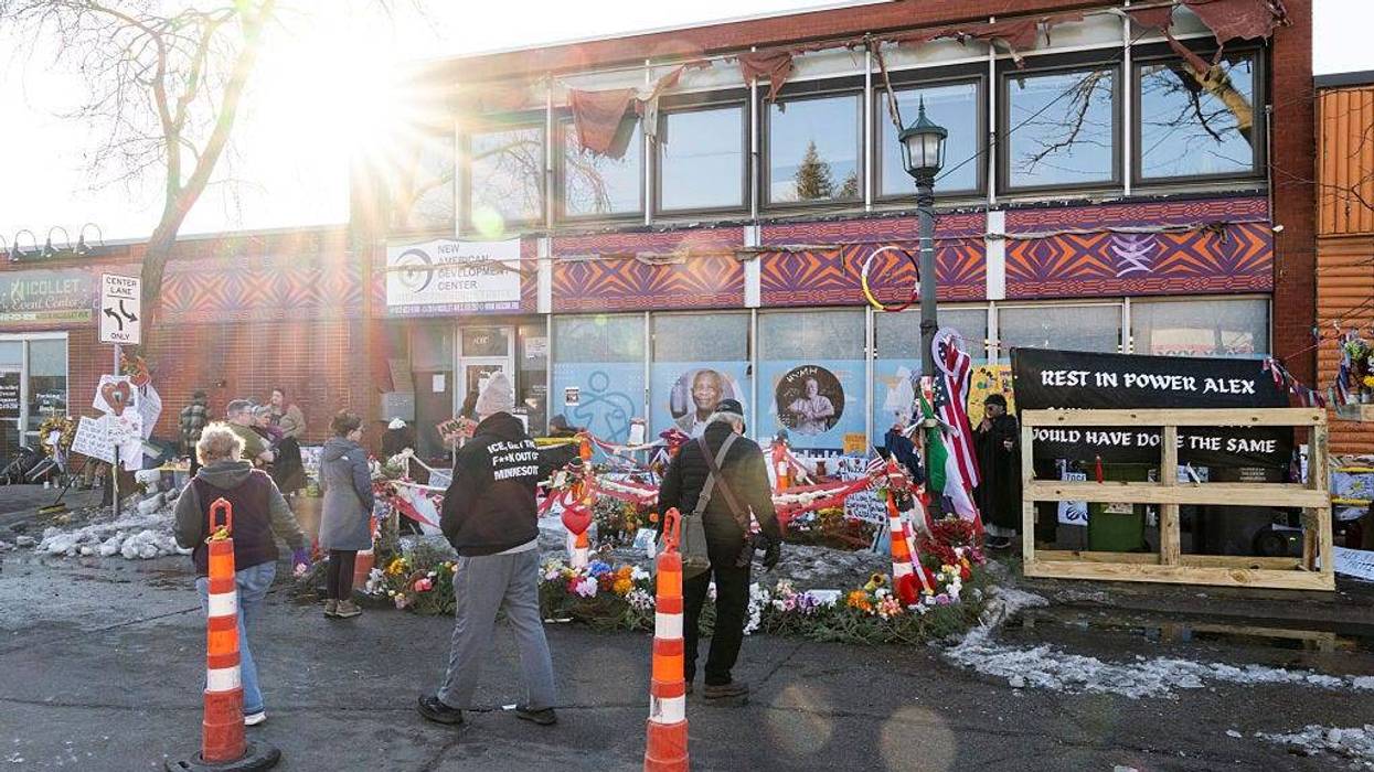 People gather at a memorial for Alex Pretti who was shot and killed by an ICE agent last month on February 12, 2026 in Minneapolis, Minnesota.