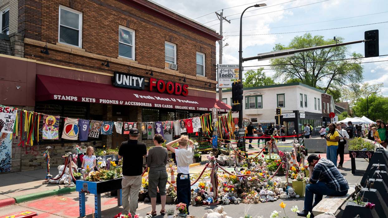 People gather at the site where George Floyd was killed during the Rise and Remember event at George Floyd Square on May 25, 2025 in Minneapolis, Minnesota.