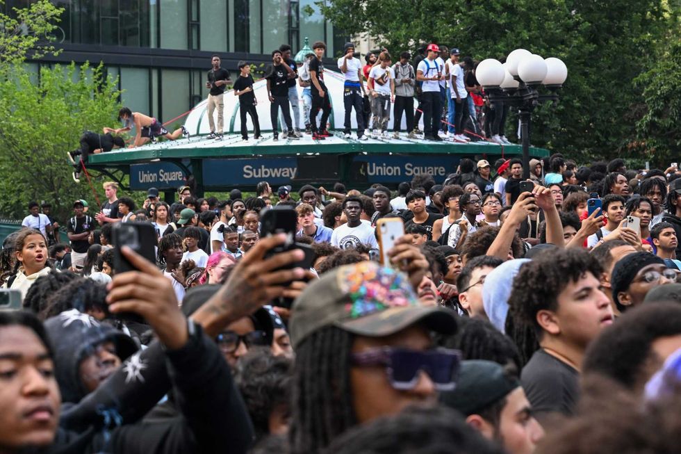 People gather for a "giveaway" event in Union Square and the surrounding area on Aug. 4, 2023