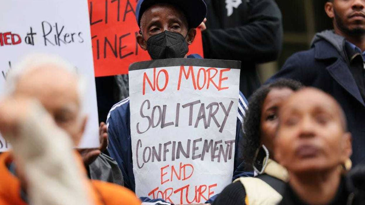 : People gather for a rally to protest the 17th death on Rikers Island at City Hall on October 25, 2022 in New York City.