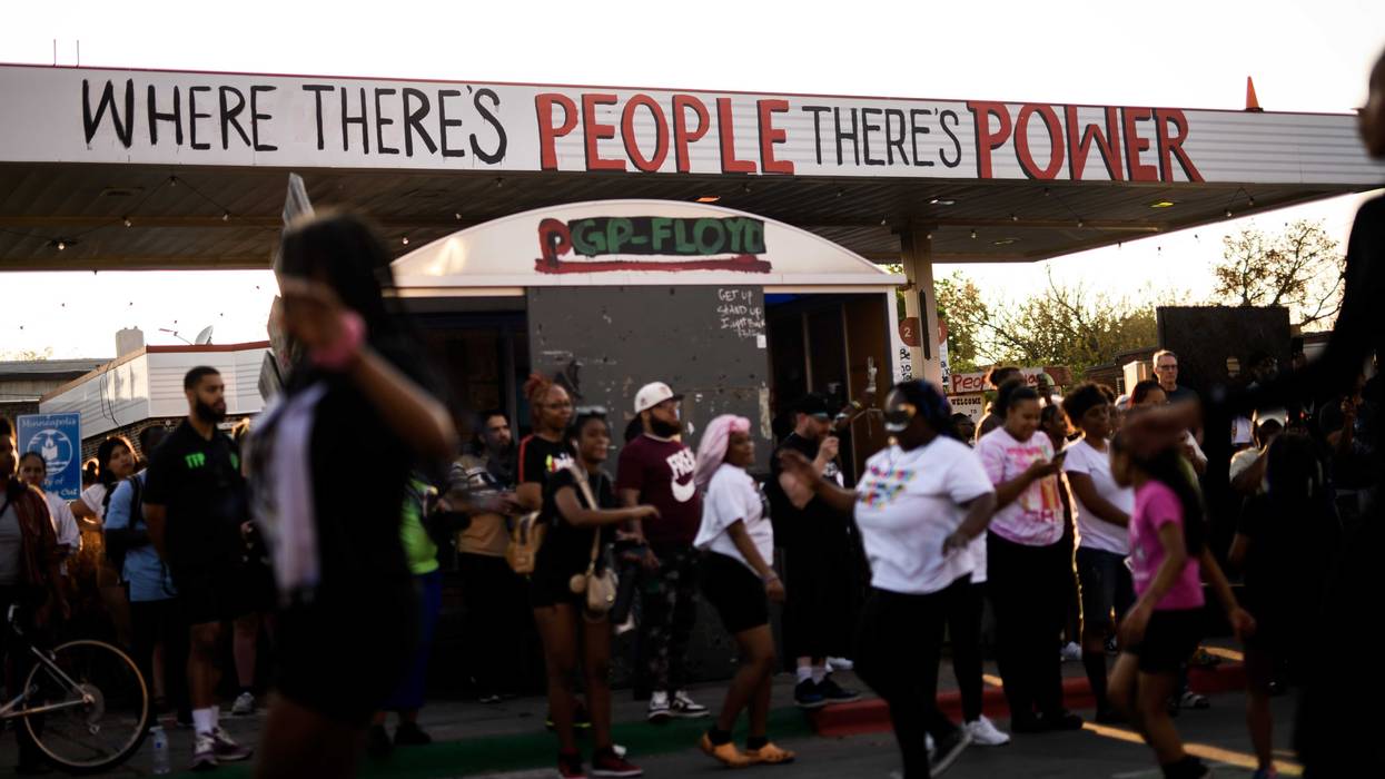 People gather for a vigil at George Floyd Square on May 25, 2023 in Minneapolis, Minnesota outside the former Speedway Station the city is looking to redevelop as a community space.