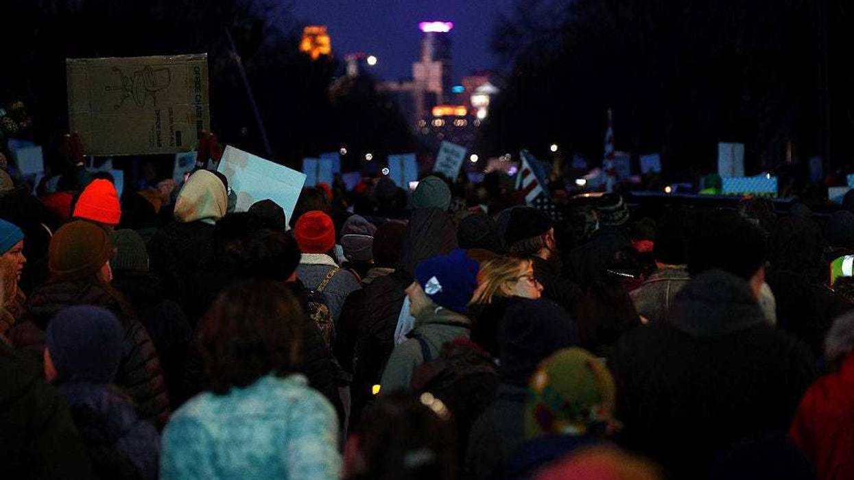 People gather for a vigil following a shooting by an ICE agent during federal law enforcement operations on January 07, 2026 in Minneapolis, Minnesota.