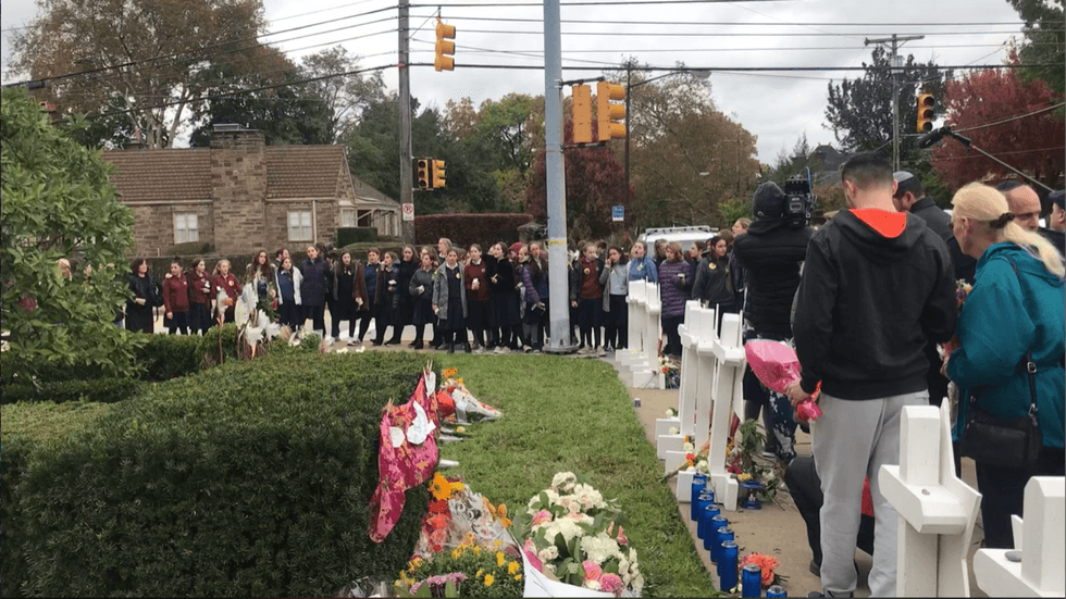 people gathering after Tree of Life shooting
