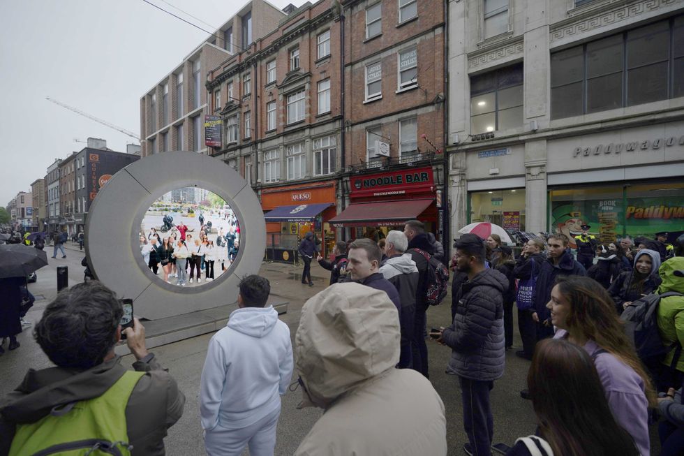 People in Dublin view the Portal to New York on May 13, 2024