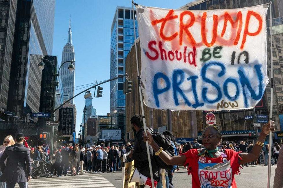 People in opposition of Republican presidential nominee, former U.S. President Donald Trump, gather outside Madison Square Garden before a campaign rally on Oct. 27, 2024.