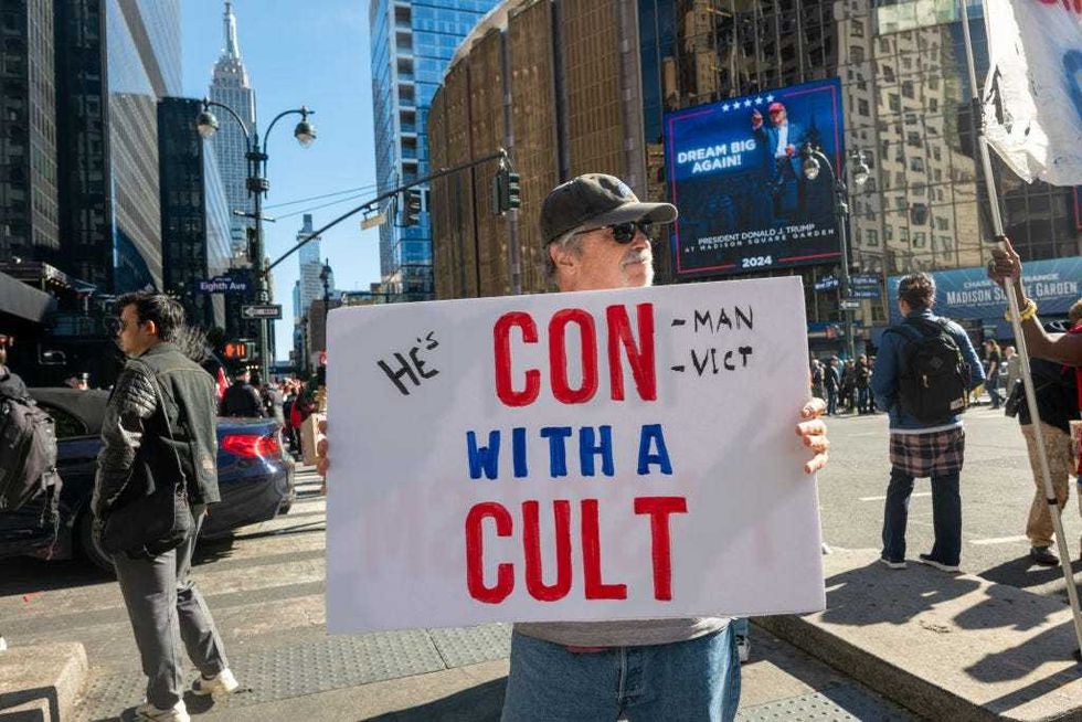 People in opposition of Republican presidential nominee, former U.S. President Donald Trump, gather outside Madison Square Garden before a campaign rally on Oct. 27, 2024.