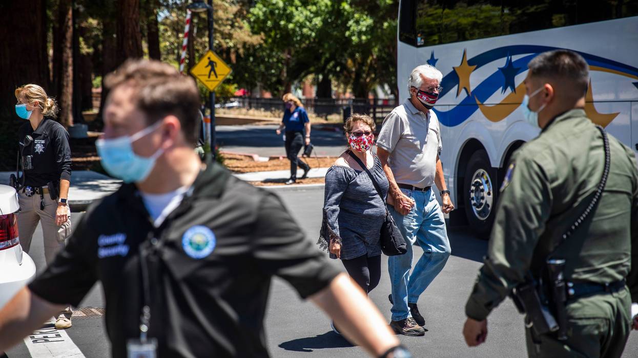 People leave a gathering point for family members and VTA employees on May 26, 2021 in San Jose, California.