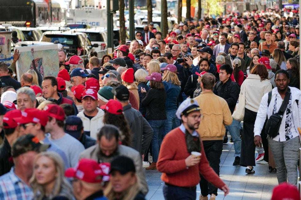 People line up to see Republican presidential nominee, former U.S. President Donald Trump speak at Madison Square Garden during a campaign rally on Oct. 27, 2024.