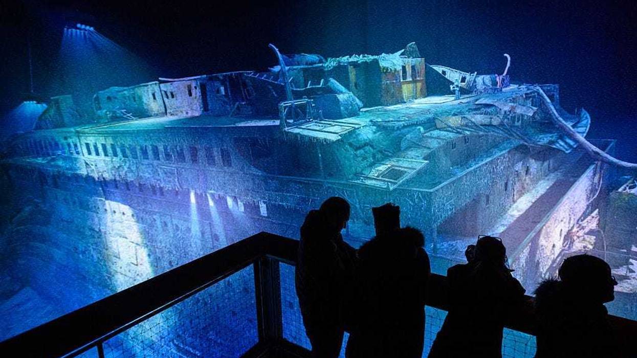 People look at a large-scale 360 degree panorama presentation of the Titanic shipwreck by artist Yadegar Asisi during a press preview on January 27, 2017 in Leipzig, Germany.