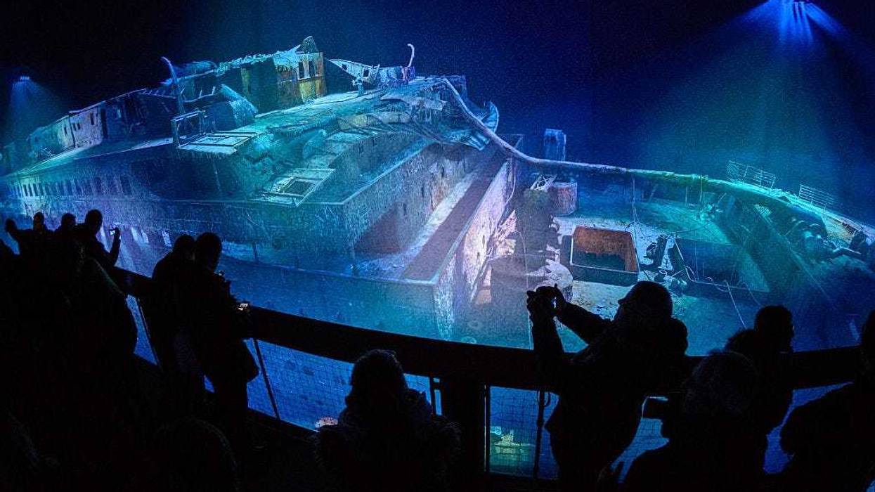 People look at a large-scale 360 degree panorama presentation of the Titanic shipwreck by artist Yadegar Asisi during a press preview on January 27, 2017 in Leipzig, Germany.
