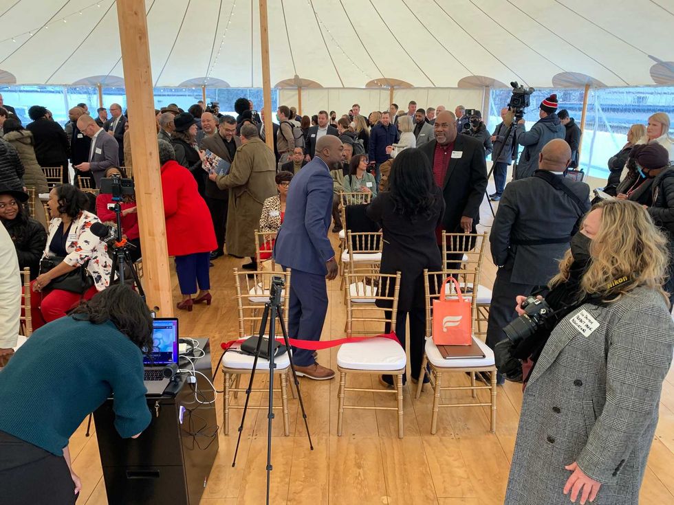 People mingle at the grand opening