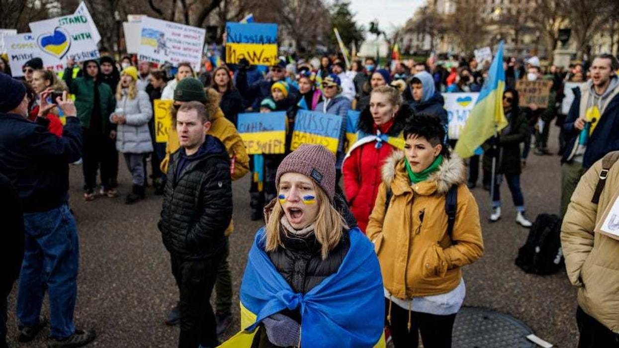 People participate in a pro-Ukrainian demonstration in front of the White House to protest the Russian Invasion of Ukraine on February 26, 2022 in Washington, DC.