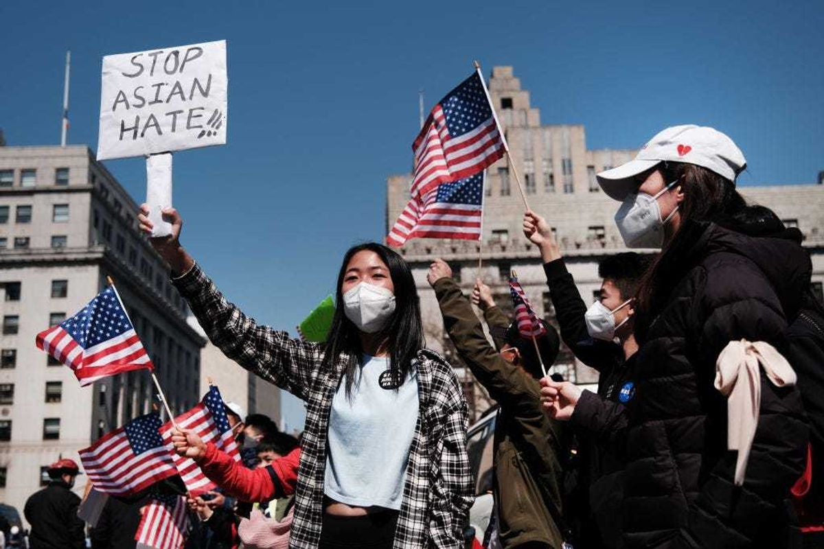 People participate in a protest to demand an end to anti-Asian violence on April 04, 2021 in New York City. The group, which numbered near 3000 and was made up of activists, residents and local politicians, marched across the Brooklyn Bridge. After a rise in hate crimes against Asians across the U.S. and in New York City, groups are speaking up and demanding more attention to the issue. (Photo by Spencer Platt/Getty Images)