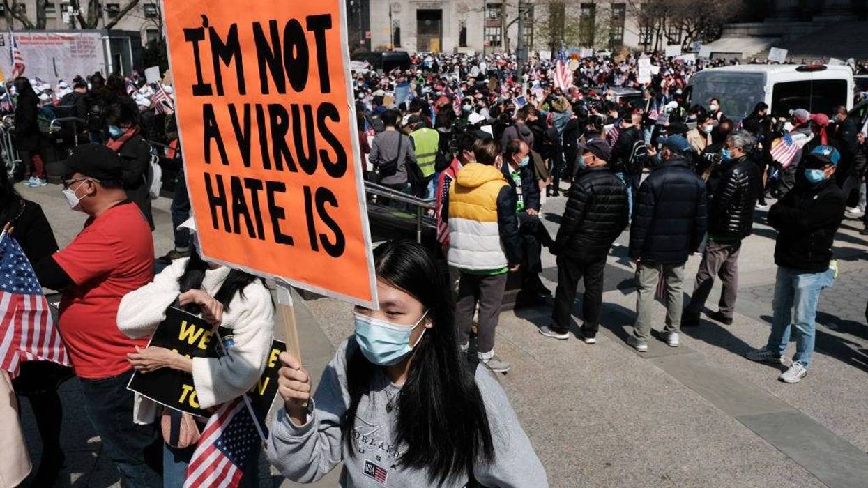 People participate in a protest to demand an end to anti-Asian violence .