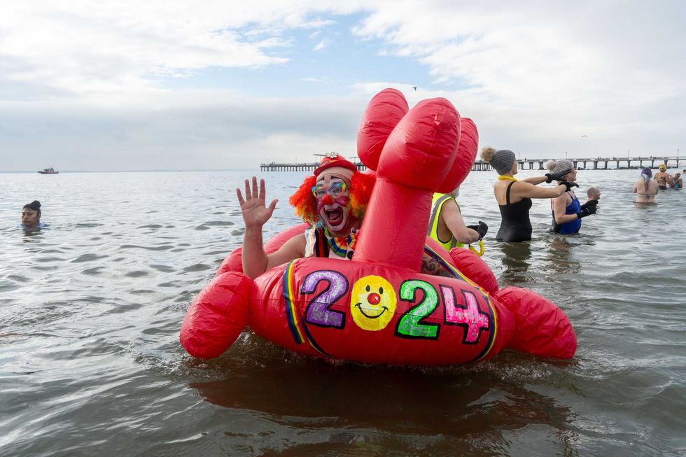 People participate in the 121st annual Polar Bear Plunge in Coney Island on January 1, 2024 in New York City.