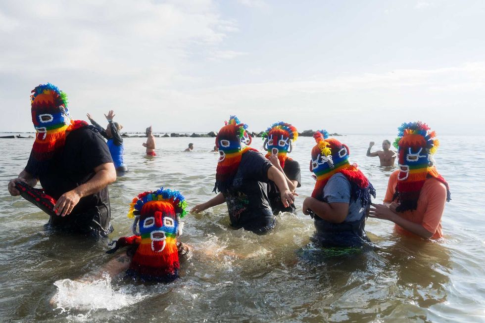People participate in the 121st annual Polar Bear Plunge in Coney Island on January 1, 2024 in New York City.