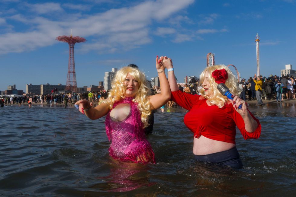 People participate in the 121st annual Polar Bear Plunge in Coney Island on January 1, 2024 in New York City.