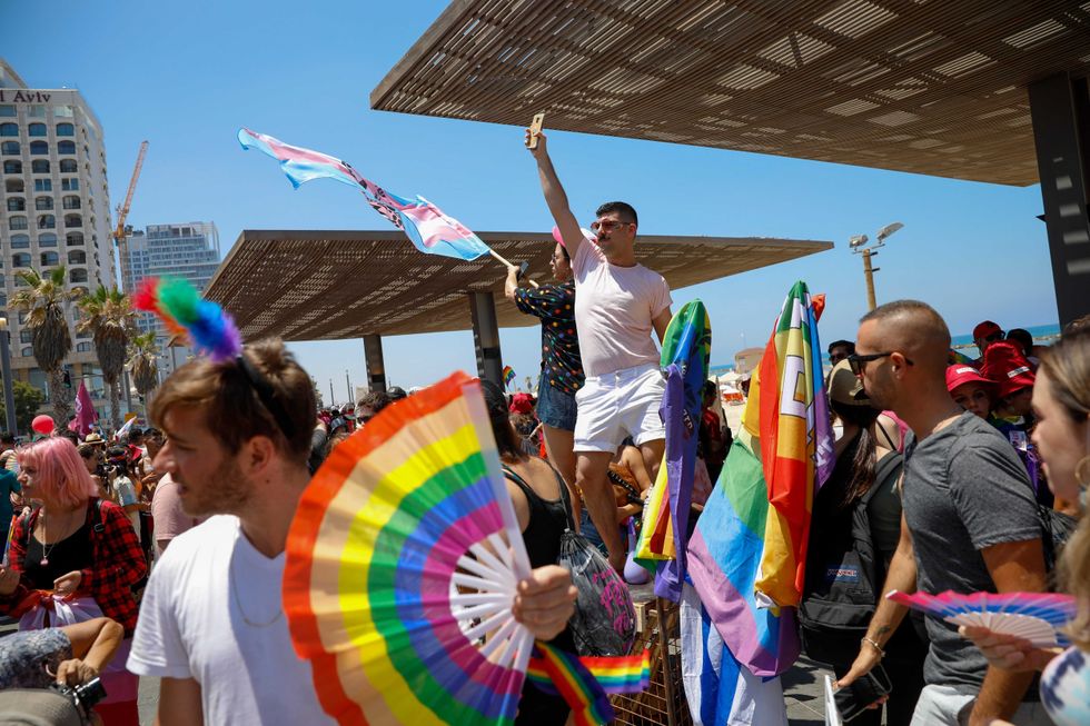 People participate in the annual Pride Parade, in Tel Aviv, Israel, Friday, June 25, 2021. Thousands of people attended the parade in one of the largest public gatherings held in Israel since the onset of the coronavirus pandemic.