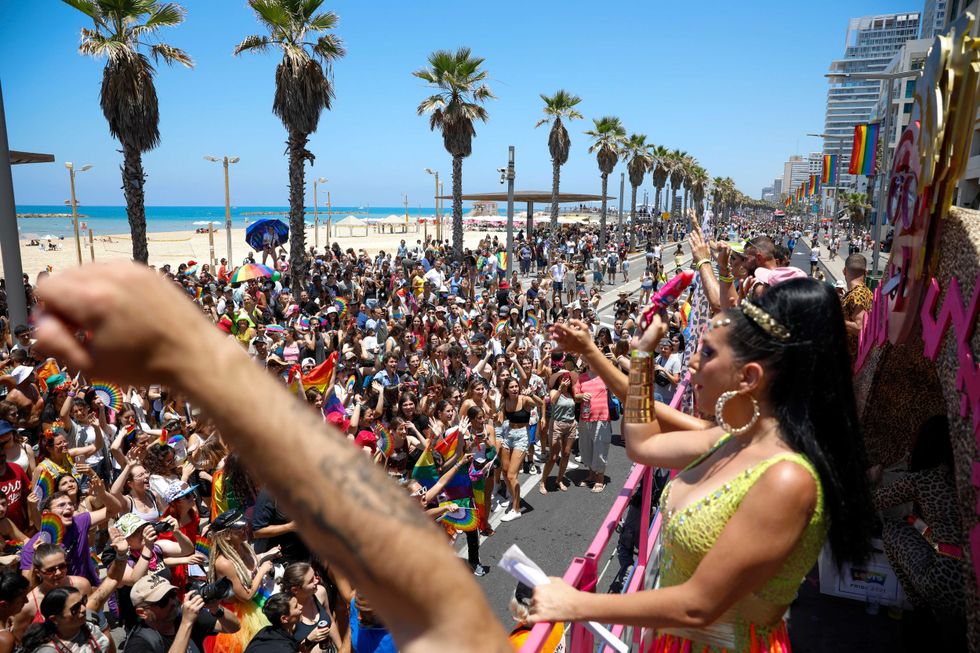 People participate in the annual Pride Parade, in Tel Aviv, Israel, Friday, June 25, 2021. Thousands of people attended the parade on Friday in one of the largest public gatherings held in Israel since the onset of the coronavirus pandemic.