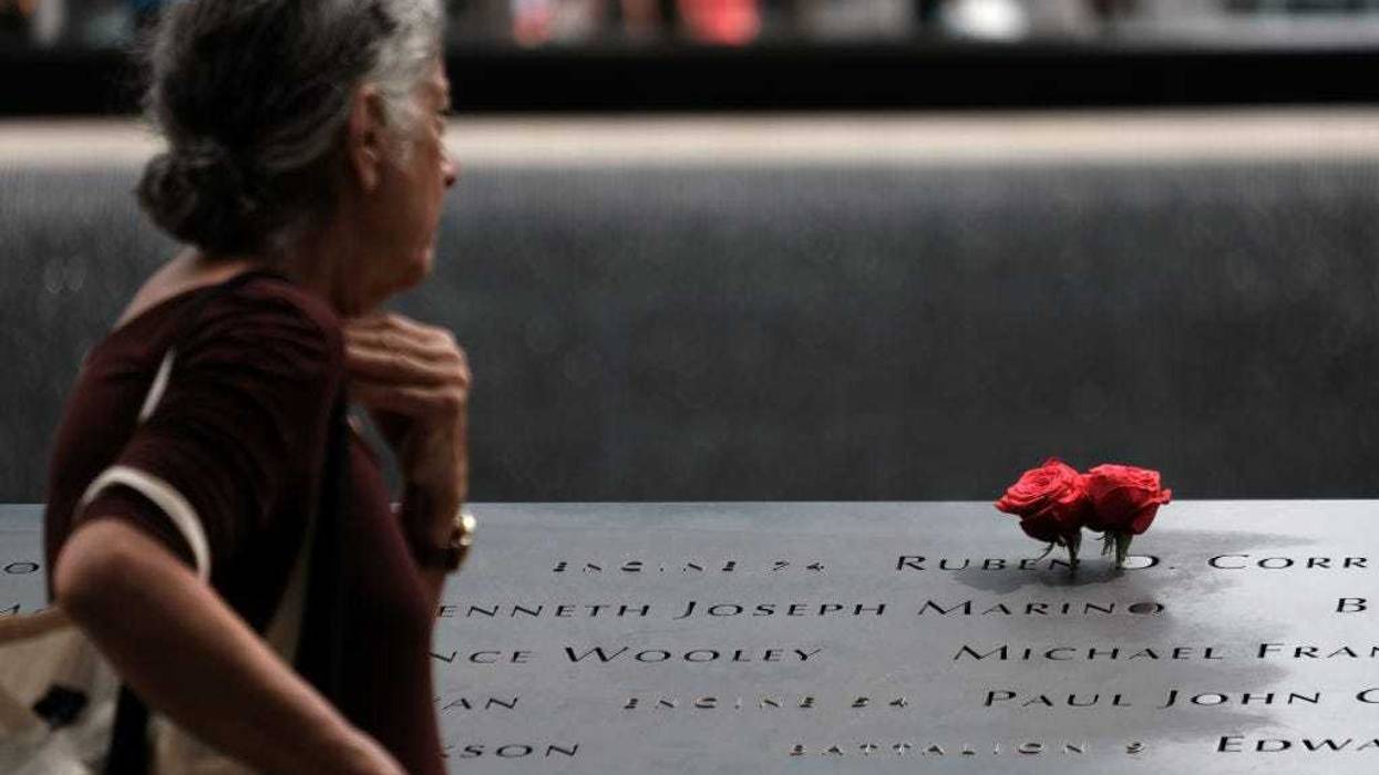 People pay their respects at the September 11 Memorial at Ground Zero on August 31, 2021 in New York City.